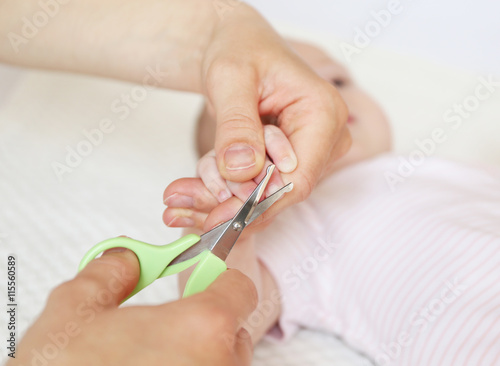 Cutting baby nails, closeup