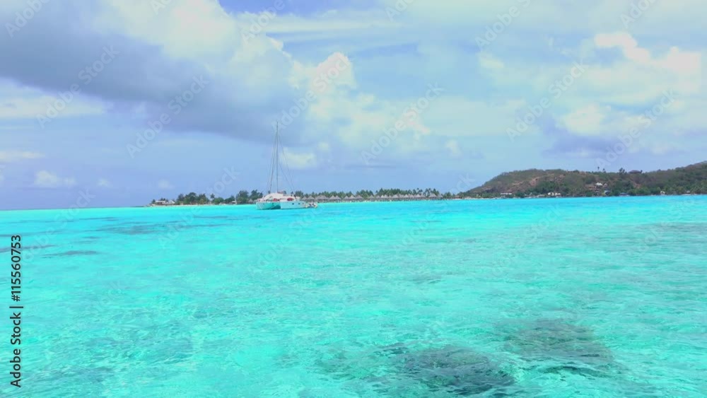 Yacht in beautiful crystal blue lagoon in Bora Bora island Yacht in beautiful crystal blue lagoon in Bora Bora island
