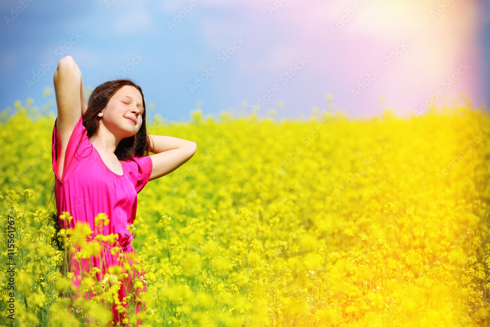 Sweet girl in meadow with wild spring flowers Sweet girl in meadow with wild spring flowers