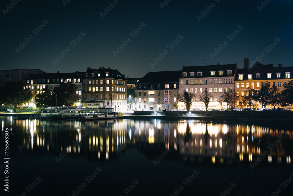Buildings along Peblinge Sø at night, in Copenhagen, Denmark.