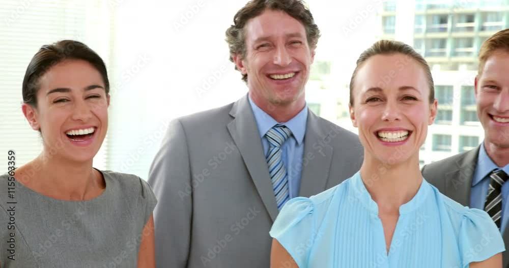 Video of happy business people looking at camera