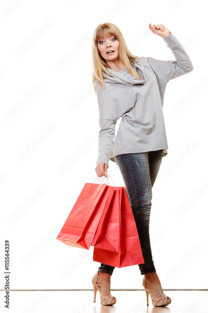 girl in full length with red shopping bags isolated girl in full length with red shopping bags isolated