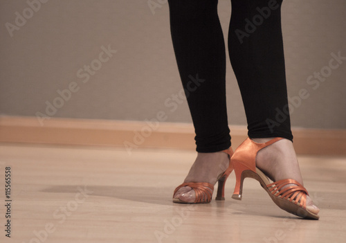 Dancers legs with orange sandals
