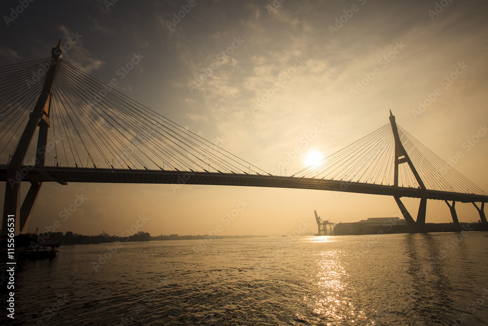 silhouette photo of sun rising sky at bhumiphol bridge important transport and moder