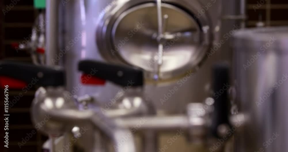 Focus on taps and gauge on vat Focus on taps and gauge on vat