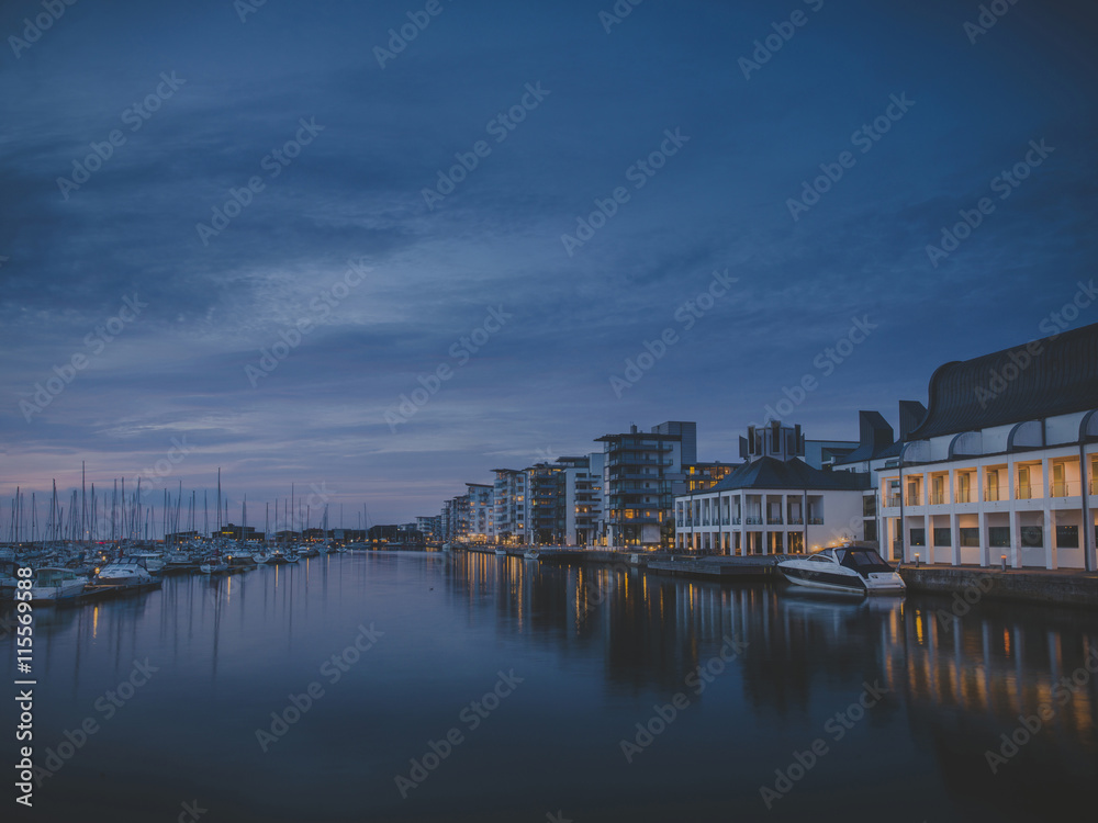 Sweden, Skane, Helsingborg, Houses by canal at dusk Sweden, Skane, Helsingborg, Houses by canal at dusk