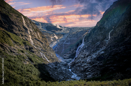 Scenic view of Kjenndalsbreen Glacier at sunrise photo