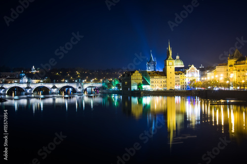 Charles Bridge and buildings along the Vltava at night, in Pragu