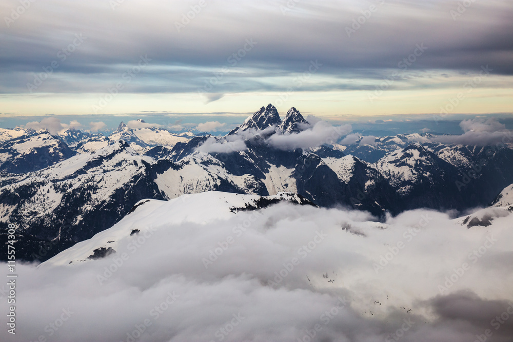 Beautiful mountain range in British Columbia, Canada. Taken near Vancouver, during a cloudy evening before sunset.