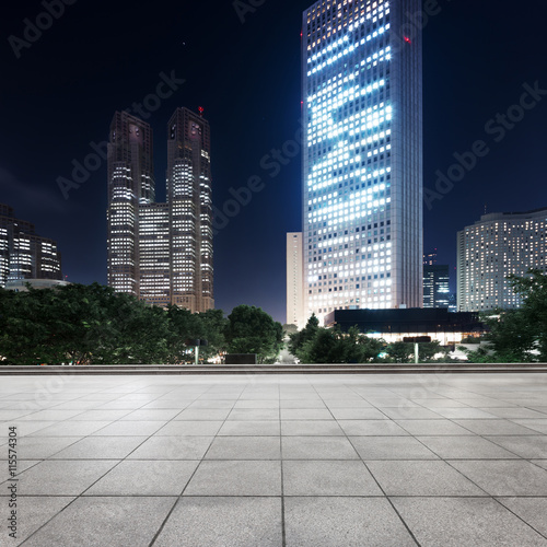 Canvas Print modern office buildings in downtown of tokyo at night