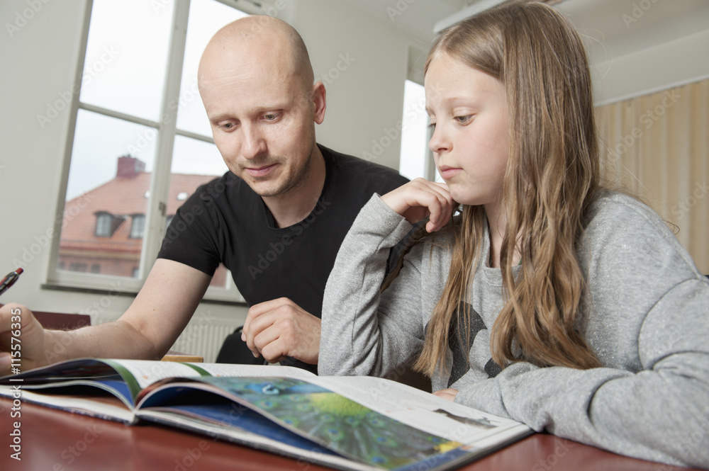 Sweden, Teacher explaining book to student (8-9) Sweden, Teacher explaining book to student (8-9)