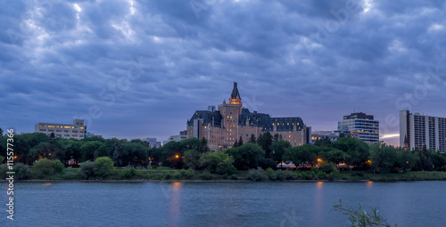 Saskatoon skyline at night along the Saskatchewan River.
