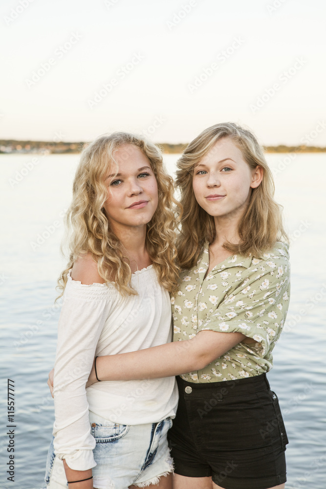 Sweden, Blekinge, Hallevik, Portrait of two teenage girls (14-15, 16-17) at bay Sweden, Blekinge, Hallevik, Portrait of two teenage girls (14-15, 16-17) at bay
