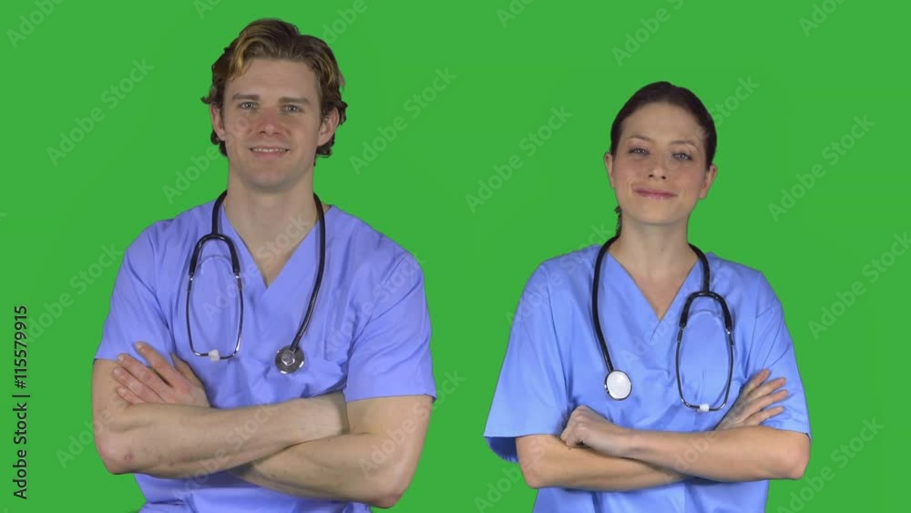 Two happy medical professionals in scrubs (Green Key) Two happy medical professionals in scrubs (Green Key)
