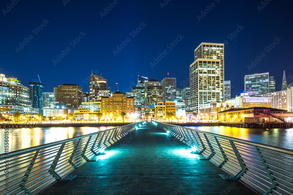 Wall Mural empty footpath over water to modern office buildings in san fran
