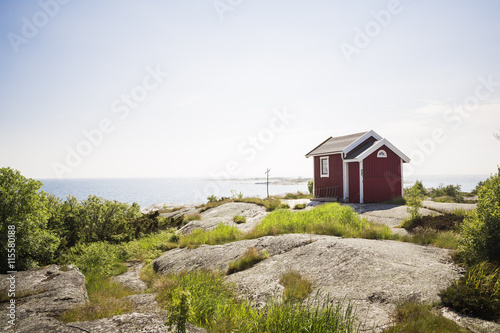 Sweden, Stockholm Archipelago, Huvudskar, View of house by sea photo