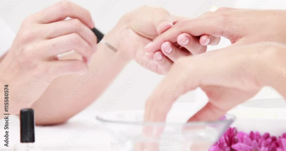 Woman getting a manicure at nail salon in high quality 4k format Woman getting a manicure at nail salon in high quality 4k format