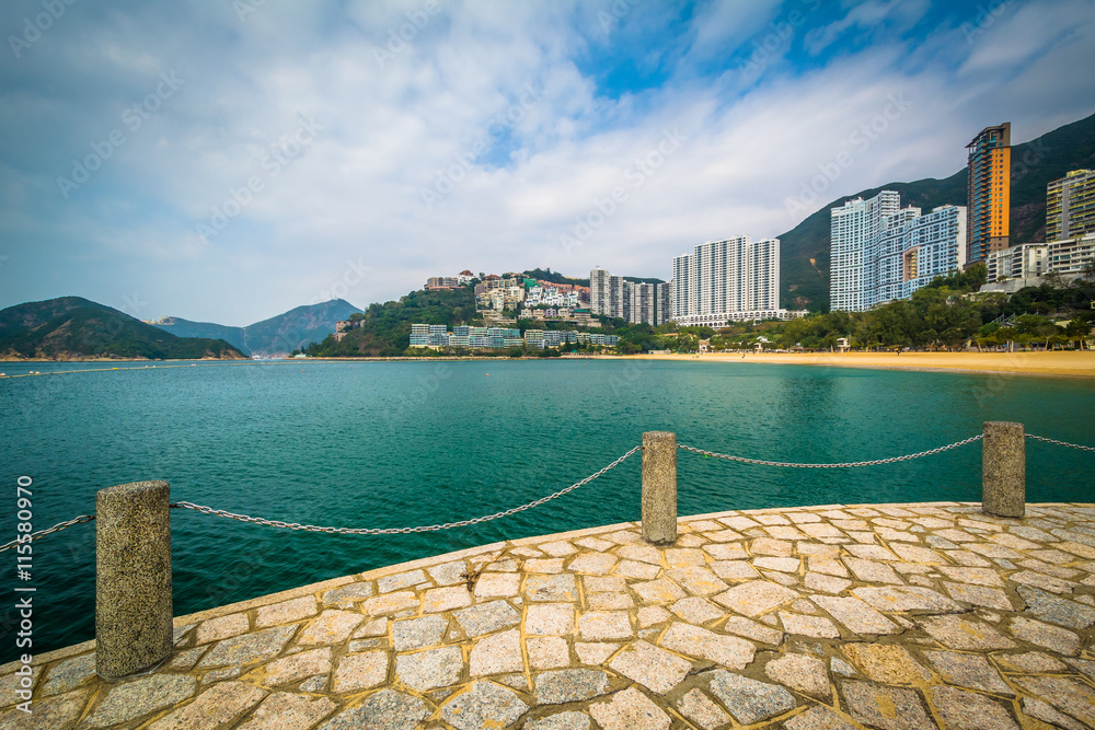 View of skyscrapers and beach from a pier at Repulse Bay, in Hon