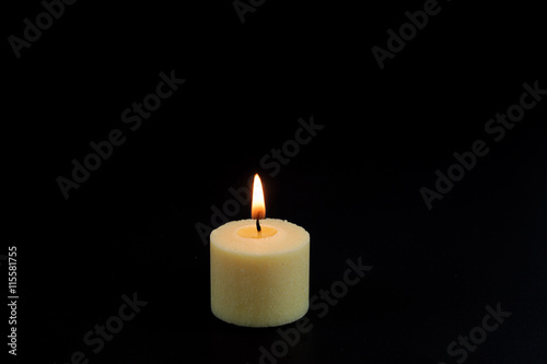 candle flame fire of white candle on black background
