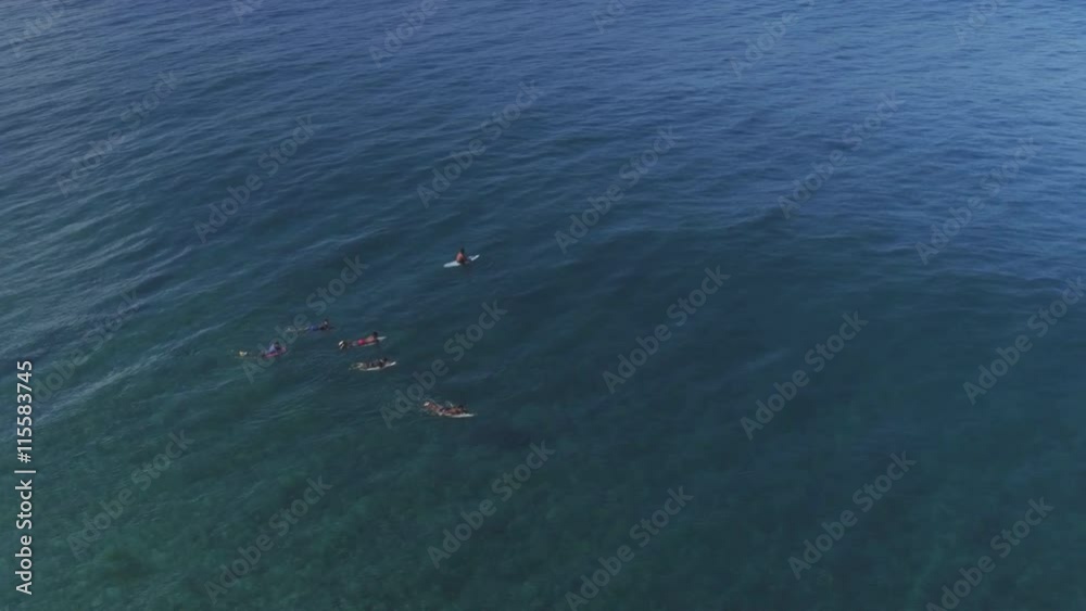 AERIAL: Pro surfers duck diving big wave surf spot Teahupoo AERIAL: Pro surfers duck diving big wave surf spot Teahupoo