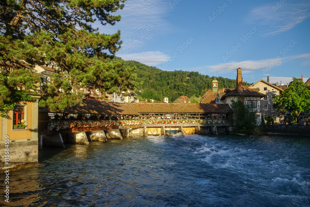 Old wooden bridge on Aare river in the Old Town of Thun in Switzerland
