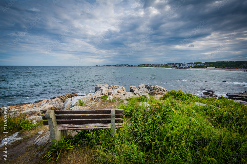 Bench and view of rocky coast in Rye, New Hampshire.