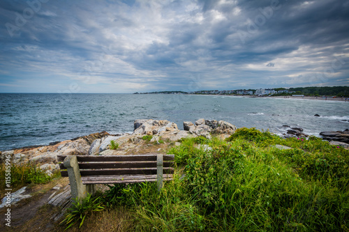 Bench and view of rocky coast in Rye  New Hampshire.