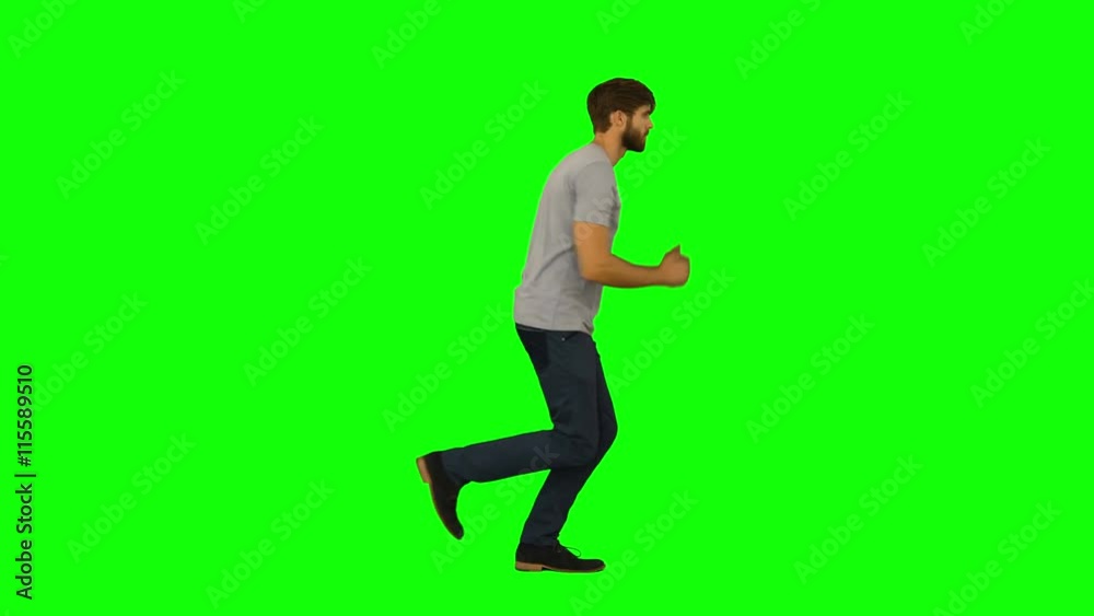 Casual man running on green screen background