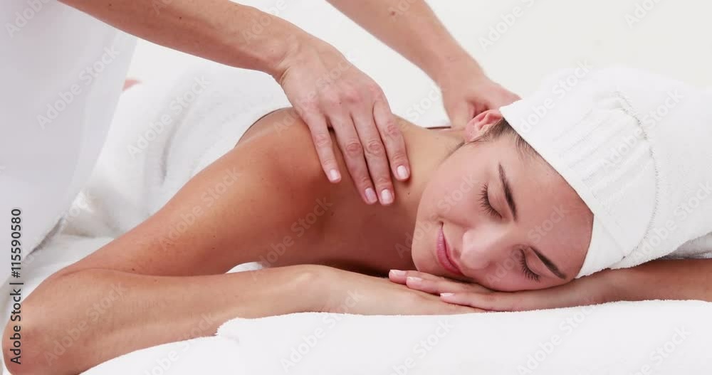 Woman enjoying a shoulder massage in high quality 4k format Woman enjoying a shoulder massage in high quality 4k format
