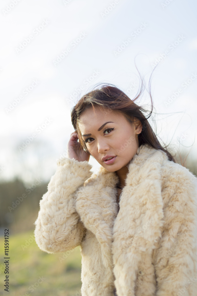 Sweden, Ostergotland, Attractive woman wearing fur coat Sweden, Ostergotland, Attractive woman wearing fur coat