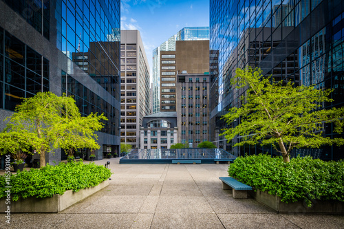 Courtyard and modern buildings in downtown Toronto, Ontario. © jonbilous