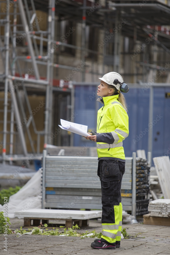 Sweden, Vastergotland, Construction worker looking at construction site Sweden, Vastergotland, Construction worker looking at construction site