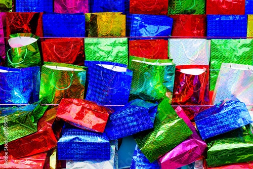 Assortment of very colorful small gift bags.