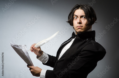 Funny writer with quill in vintage concept photo
