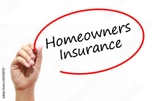 Man Hand writing Homeowners Insurance with marker on transparent wipe board. Business, internet, technology concept.