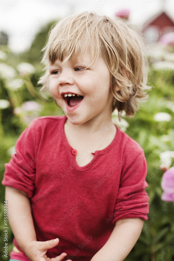 Sweden, Sodermanland, Strangnas, Girl (2-3) in garden laughing Sweden, Sodermanland, Strangnas, Girl (2-3) in garden laughing