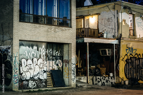 Graffiti on buildings in Kensington Market at night, Toronto, On photo