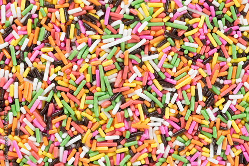 Colorful candy sprinkles background. Top view