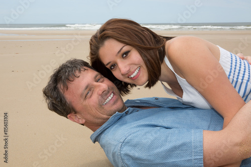 Happy honeymooners enjoying their vacation on beach