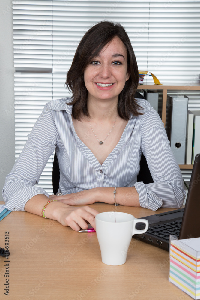 Attractive young woman working at the desk laptop. Attractive young woman working at the desk laptop.