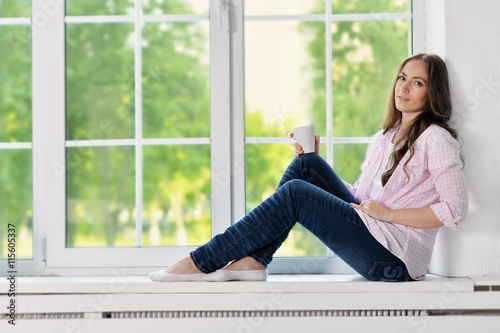 Happy young woman with tea Free Download Happy young woman with tea - GFXLoad