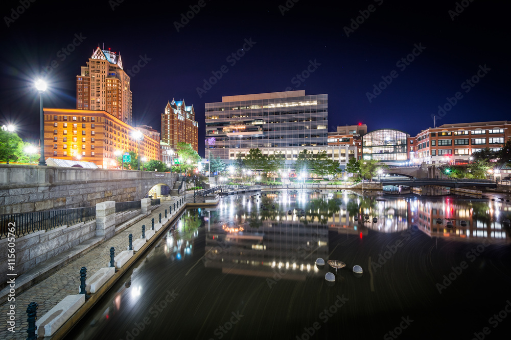 Modern buildings and the Providence River at night, in downtown