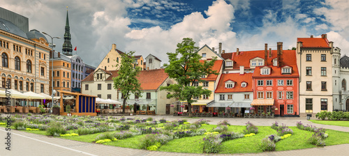 Panoramic view on flowered Livu square in the center of old Riga with numerous coffee shops and restaurants, Latvia
