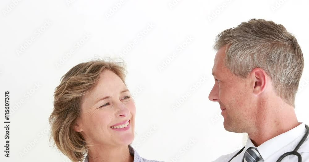 Doctor showing X rays to his patient Doctor showing X rays to his patient