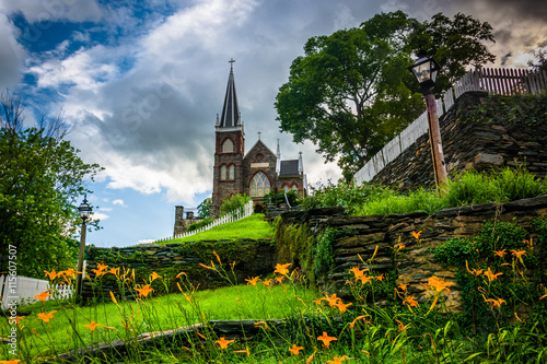 Orange lillies and St. Peters Roman Catholic Church, in Harpers