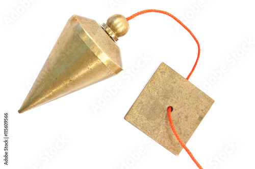 Fotografie Vertical plumb bob isolated on white