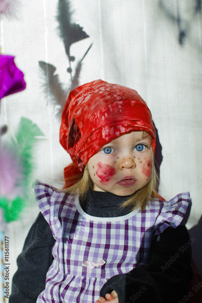 Girl (4-5) wearing costume of witch at Eastertime Girl (4-5) wearing costume of witch at Eastertime