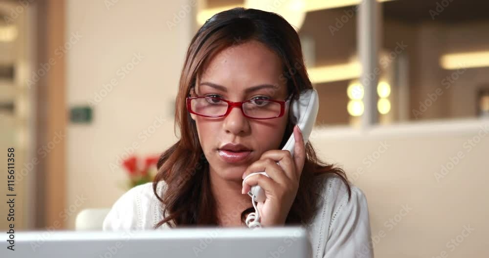 Smiling casual businesswoman having a phone call in the office Smiling casual businesswoman having a phone call in the office
