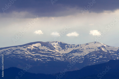 Mountain snow peak in carpathian with dramatic sky © callipso88