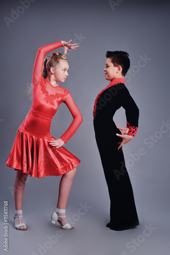 Two beautiful children dancing ballroom dance sport